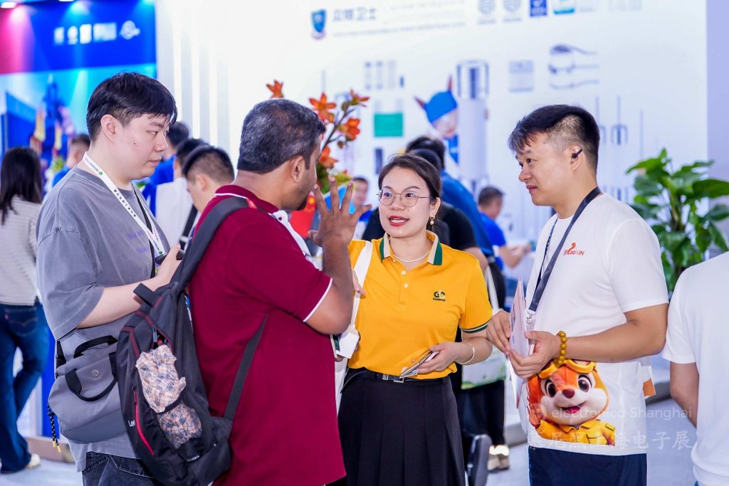 G.A.Group Team Communicating with International Visitors in Exhibition Hallway electronica Shanghai 2026